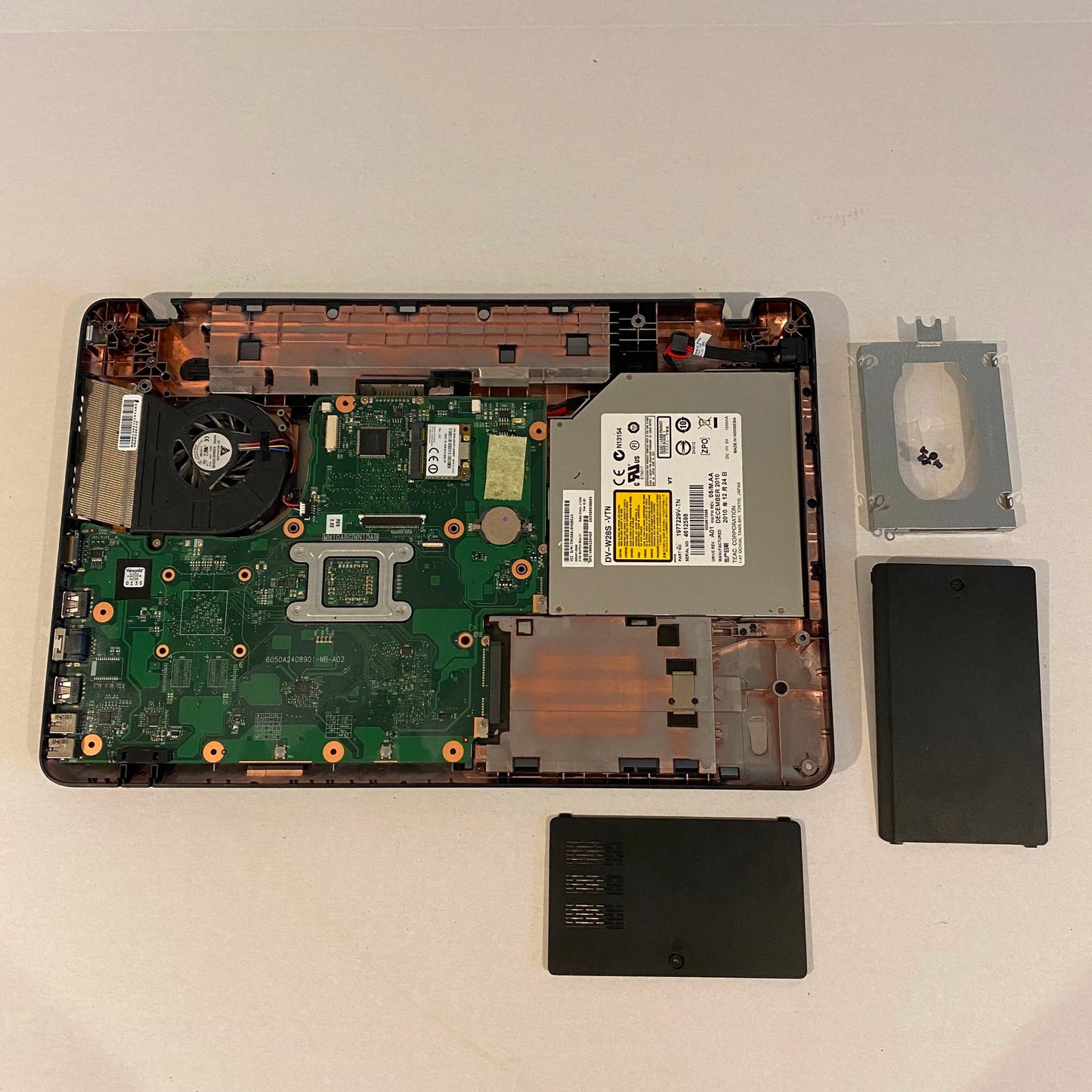 Toshiba Satellite C650D Motherboard and Bottom Case, RAM, HHD Cover and Caddy