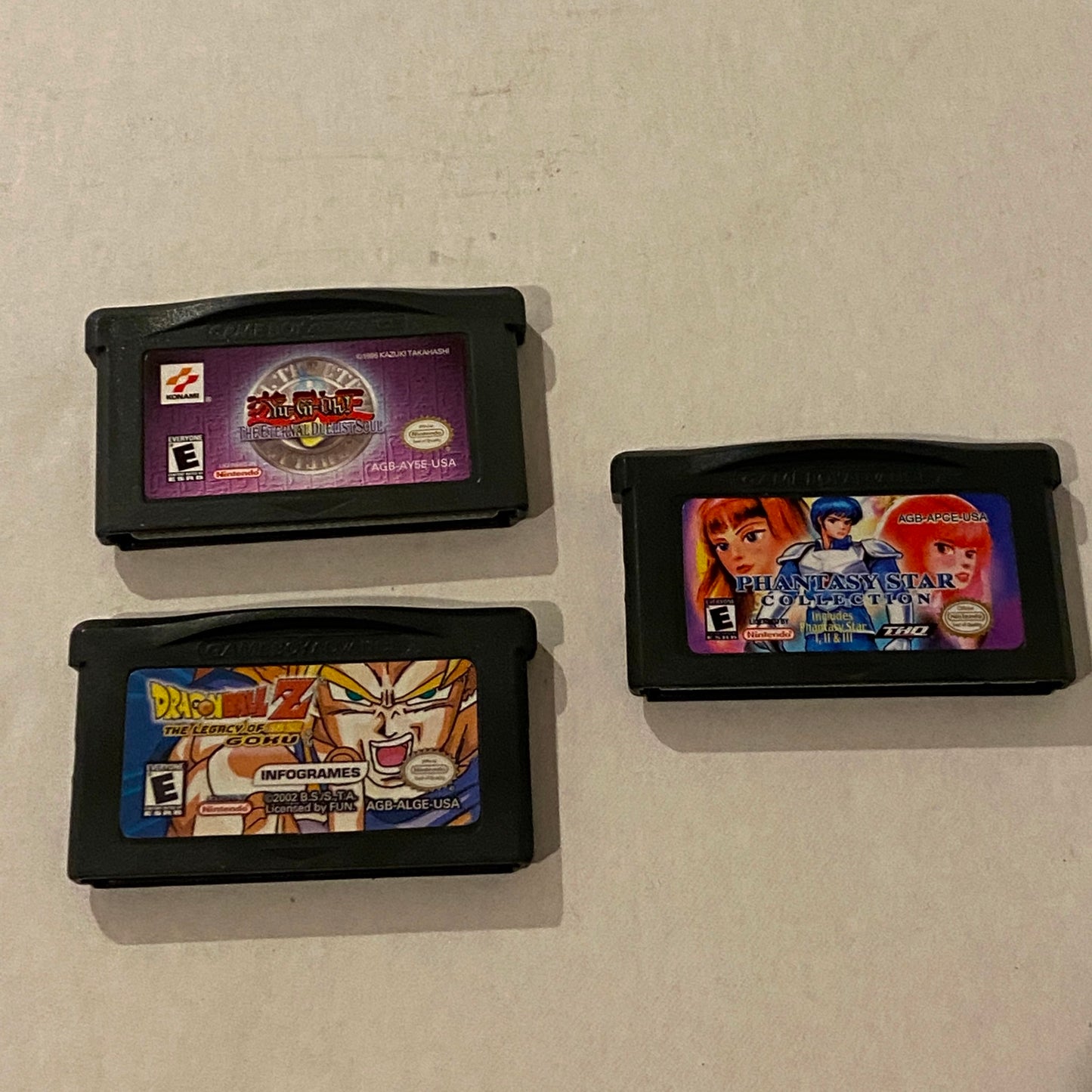 Lot of 3 Nintendo Game Boy Advance Games - Phantasy Star, Dragonball Z, Yu-Gi-Oh